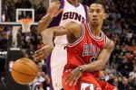 PHOENIX - JANUARY 22:  Derrick Rose #1 of the Chicago Bulls passes the ball during the NBA game against the Phoenix Suns at US Airways Center on January 22, 2010 in Phoenix, Arizona.  The Bulls defeated the Suns 115-104.  NOTE TO USER: User expressly acknowledges and agrees that, by downloading and or using this photograph, User is consenting to the terms and conditions of the Getty Images License Agreement.  (Photo by Christian Petersen/Getty Images)