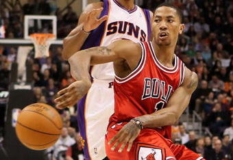 PHOENIX - JANUARY 22:  Derrick Rose #1 of the Chicago Bulls passes the ball during the NBA game against the Phoenix Suns at US Airways Center on January 22, 2010 in Phoenix, Arizona.  The Bulls defeated the Suns 115-104.  NOTE TO USER: User expressly acknowledges and agrees that, by downloading and or using this photograph, User is consenting to the terms and conditions of the Getty Images License Agreement.  (Photo by Christian Petersen/Getty Images)