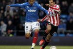 PORTSMOUTH, ENGLAND - JANUARY 23:  Kevin-Prince Boateng of Portsmouth tries to tackle Kieran Richardson of Sunderland during the FA Cup 4th Round sponsored by E.on match between Portsmouth and Sunderland at Fratton Park  on January 23, 2010 in Portsmouth, England.  (Photo by Ian Walton/Getty Images)