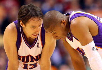 PHOENIX - DECEMBER 30:  Steve Nash #13 of the Phoenix Suns talks with Leandro Barbosa #10 during the NBA game against the Boston Celtics at US Airways Center on December 30, 2009 in Phoenix, Arizona. The Suns defeated the Celtics 116-98.  NOTE TO USER: User expressly acknowledges and agrees that, by downloading and or using this photograph, User is consenting to the terms and conditions of the Getty Images License Agreement.  (Photo by Christian Petersen/Getty Images)