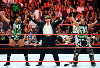 LAS VEGAS - AUGUST 24:  (L-R) Wrestler Triple H, World Wrestling Entertainment Inc. Chairman Vince McMahon and wrestler Shawn Michaels appear in the ring during the WWE Monday Night Raw show at the Thomas & Mack Center August 24, 2009 in Las Vegas, Nevada.  (Photo by Ethan Miller/Getty Images)