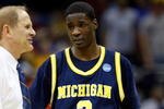 KANSAS CITY, MO - MARCH 19:  Head Coach John Beilein and Manny Harris #3 of the Michigan Wolverines look on after their first round game against the Clemson Tigers in the NCAA Division I Men's Basketball Tournament at the Sprint Center on March 19, 2009 in Kansas City, Missouri.  The Wolverines defeated the Tigers 62-59.  (Photo by Jamie Squire/Getty Images)