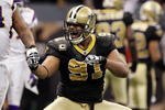 NEW ORLEANS - JANUARY 24:  Will Smith #91 of the New Orleans Saints reacts after a fumble in the fourth quarter against the Minnesota Vikings looks on during the NFC Championship Game at the Louisiana Superdome on January 24, 2010 in New Orleans, Louisiana.  (Photo by Jed Jacobsohn/Getty Images)