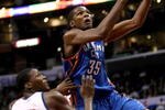 LOS ANGELES, CA - NOVEMBER 11:  Kevin Durant #35 of the Oklahoma City Thunder goes up fora shot over Al Thornton #12 of the Los Angeles Clippers on November 11, 2009 at Staples Center in Los Angeles, California.    NOTE TO USER: User expressly acknowledges and agrees that, by downloading and/or using this Photograph, user is consenting to the terms and conditions of the Getty Images License Agreement.  (Photo by Stephen Dunn/Getty Images)