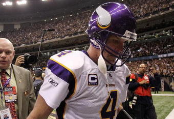 NEW ORLEANS - JANUARY 24:  Brett Favre #4 of the Minnesota Vikingswalks off of the field after losing against the New Orleans Saints in the NFC Championship Game at the Louisiana Superdome on January 24, 2010 in New Orleans, Louisiana.  (Photo by Ronald Martinez/Getty Images)