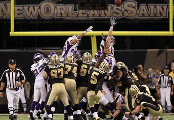 NEW ORLEANS - JANUARY 24:  Kicker Garrett Hartley #5 of the New Orleans Saints kicks a gaming winning field goal in overtime against the Minnesota Vikings to win the NFC Championship Game at the Louisiana Superdome on January 24, 2010 in New Orleans, Louisiana.  (Photo by Jed Jacobsohn/Getty Images)