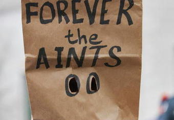 CHICAGO - JANUARY 21: A fan with a paper bag on his head with the words 'Forever the Aints Bear Down' on it stands outside before the NFC Championship Game between the New Orleans Saints and the Chicago Bears on January 21, 2007 at Soldier Field in Chicago, Illinois.  (Photo by Al Bello/Getty Images)