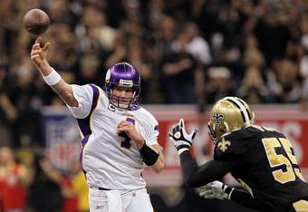 NEW ORLEANS - JANUARY 24:  Brett Favre #4 of the Minnesota Vikings drops back to pass against Scott Fujita #55 of the New Orleans Saints during the NFC Championship Game at the Louisana Superdome on January 24, 2010 in New Orleans, Louisiana.  (Photo by Jed Jacobsohn/Getty Images)
