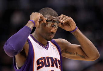 PHOENIX - JANUARY 22:  Amar'e Stoudemire #1 of the Phoenix Suns adjusts his glasses during the NBA game against the Chicago Bulls at US Airways Center on January 22, 2010 in Phoenix, Arizona. The Bulls defeated the Suns 115-104.  NOTE TO USER: User expressly acknowledges and agrees that, by downloading and or using this photograph, User is consenting to the terms and conditions of the Getty Images License Agreement.  (Photo by Christian Petersen/Getty Images)
