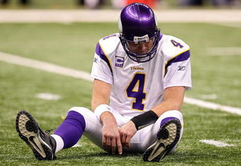 NEW ORLEANS - JANUARY 24:  Brett Favre #4 of the Minnesota Vikings sits on the turf after getting knocked down on a play against the New Orleans Saints during the NFC Championship Game at the Louisana Superdome on January 24, 2010 in New Orleans, Louisiana.  (Photo by Ronald Martinez/Getty Images)