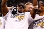 NEW ORLEANS - JANUARY 24: (L-R)  Jonathan Vilma #51, Jeremy Shockey #88 and Darren Sharper #42 of the New Orleans Saints celebrates with the NFC Championship trophy after the Saints won 31-28 in overtime against the Minnesota Vikings during the NFC Championship Game at the Louisiana Superdome on January 24, 2010 in New Orleans, Louisiana.  (Photo by Chris Graythen/Getty Images)