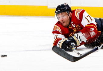 ATLANTA - JANUARY 14:  Ilya Kovalchuk #17 of the Atlanta Thrashers dives to keep the puck in play against the Buffalo Sabres at Philips Arena on January 14, 2010 in Atlanta, Georgia.  (Photo by Kevin C. Cox/Getty Images)