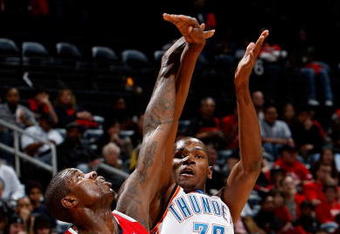 ATLANTA - JANUARY 18:  Kevin Durant #35 of the Oklahoma City Thunder shoots over Marvin Williams #24 of the Atlanta Hawks at Philips Arena on January 18, 2010 in Atlanta, Georgia.  NOTE TO USER: User expressly acknowledges and agrees that, by downloading and/or using this Photograph, User is consenting to the terms and conditions of the Getty Images License Agreement.  (Photo by Kevin C. Cox/Getty Images)
