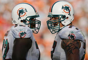 MIAMI - NOVEMBER 09:  Offensive linemen Vernon Carey #72 and Jake Long #77 of the Miami Dolphins talk between plays while taking on the Seattle Seahawks at Dolphin Stadium on November 9, 2008 in Miami, Florida. The Dolphins defeated the Seahawks 21-19.  (Photo by Doug Benc/Getty Images)