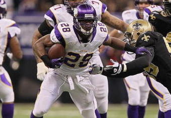 NEW ORLEANS - JANUARY 24:  Adrian Peterson #28 of the Minnesota Vikings runs runs the ball against the New Orleans Saints during the NFC Championship Game at the Louisana Superdome on January 24, 2010 in New Orleans, Louisiana.  (Photo by Jed Jacobsohn/Getty Images)