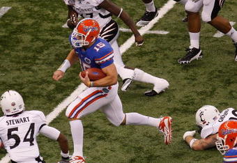 NEW ORLEANS - JANUARY 01:  Tim Tebow #15 of the Florida Gators runs through the defense of the Cincinnati Bearcats during the Allstate Sugar Bowl at the Louisana Superdome on January 1, 2010 in New Orleans, Louisiana.  (Photo by Chris Graythen/Getty Images)