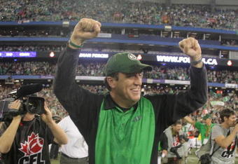 TORONTO, ON - NOVEMBER 25: Head Coach  Kent Austin of the Saskatchewan Rough Riders raises his arms to celebrate a victory over the Winnipeg Blue Bombers during the 95th Grey Cup on November 25, 2007 at the Rogers Centre in Toronto, Ontario, Canada.  (Photo by Harry How/Getty Images)