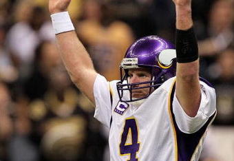NEW ORLEANS - JANUARY 24:  Brett Favre #4 of the Minnesota Vikings reacts after the Vikings scored a touchdown against the New Orleans Saints during the NFC Championship Game at the Louisiana Superdome on January 24, 2010 in New Orleans, Louisiana. The Saints won 31-28 in overtime.  (Photo by Jed Jacobsohn/Getty Images)