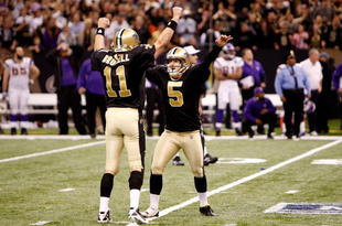 NEW ORLEANS - JANUARY 24:  Kicker Garrett Hartley #5 and holder Mark Brunell #11 of the New Orleans Saints celebrate after Hartley kicked a 40-yard game-winning field goal in overtime against the Minnesota Vikings during the NFC Championship Game at the Louisiana Superdome on January 24, 2010 in New Orleans, Louisiana.  (Photo by Chris Graythen/Getty Images)