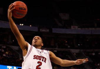 TAMPA, FL - MARCH 13:  Devan Downey #2 of the South Carolina Gamecocks makes a layup around Dee Bost #3 of the Mississippi State Bulldogs during the quaterfinal round of the SEC Men's Basketball Tournament on March 13, 2009 at The St. Pete Times Forum in Tampa, Florida.  (Photo by Chris Graythen/Getty Images)