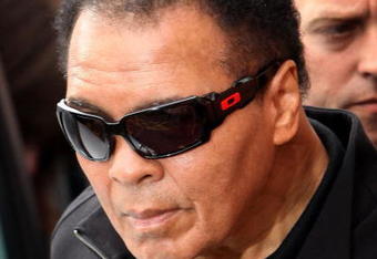 MANCHESTER, ENGLAND - AUGUST 26:  Boxing legend Muhammad Ali arrives at Ricky Hatton's gym as part of his UK charity tour on August 26, 2009 in Manchester, England. Ali met the Manchester boxer Ricky Hatton as part of his charity tour of the UK where he is raising cash for the charities that he supports. He was greeted with chants of 'Ali' by the crowd waiting for a glimpse of the sporting hero who although frail managed to wave at the crowd.  (Photo by Christopher Furlong/Getty Images)