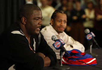 AUBURN HILLS, MI - NOVEMBER 04: President of Basketball Operations Joe Dumars of the Detroit Pistons introduces Allen Iverson #1 at press conference after being traded from the Denver Nuggets on November 4, 2008 at the Palace of Auburn Hills in Auburn Hills, Michigan. NOTE TO USER: User expressly acknowledges and agrees that, by downloading and or using this photograph, User is consenting to the terms and conditions of the Getty Images License Agreement.  (Photo by Gregory Shamus/Getty Images)