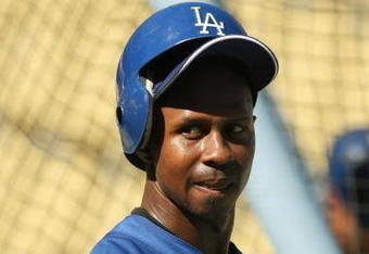 LOS ANGELES, CA - OCTOBER 16:  Juan Pierre #9  of the Los Angeles Dodgers looks on during warm ups prior to the start of Game Two of the NLCS against the Philadelphia Phillies during the 2009 MLB Playoffs at Dodger Stadium on October 16, 2009 in Los Angeles, California.  (Photo by Stephen Dunn/Getty Images)
