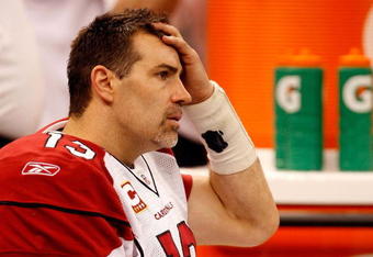 NEW ORLEANS - JANUARY 16:  Quarterback Kurt Warner #13 of the Arizona Cardinals looks on dejected from the bench in the second half against the New Orleans Saints during the NFC Divisional Playoff Game at Louisana Superdome on January 16, 2010 in New Orleans, Louisiana.  (Photo by Ronald Martinez/Getty Images)