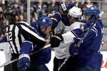 TORONTO - JANUARY 26: Ian White #7 and Luke Schenn #2 of the Toronto Maple Leafs rough up Wayne Simmonds #17 of the Los Angeles Kings during game action January 26, 2010 at the Air Canada Centre in Toronto, Ontario, Canada. (Photo by Abelimages / Getty Images)
