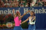 26 Jan 2001:  Venus Williams (right) celebrates with sister and doubles partner Serena Williams (left) both of the USA after winning the Doubles title at the Australian Open 2001 Women's Doubles Final match played at Melbourne Park, in Melbourne, Australia. \ Mandatory Credit: Clive Brunskill /Allsport