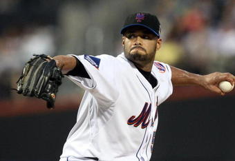 NEW YORK - AUGUST 20:  Johan Santana #57 of the New York Mets delivers a pitch against the Atlanta Braves on August 20, 2009 at Citi Field in the Flushing neighborhood of the Queens borough of New York City.  (Photo by Jim McIsaac/Getty Images)