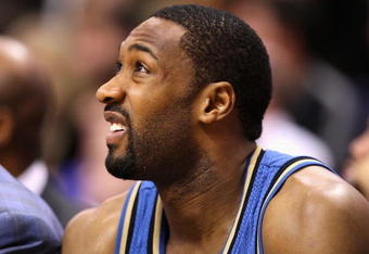 PHOENIX - DECEMBER 19:  Gilbert Arenas #0 of the Washington Wizards sits on the bench during the NBA game against the Phoenix Suns at US Airways Center on December 19, 2009 in Phoenix, Arizona. The Suns defeated the Wizards 121-95. NOTE TO USER: User expressly acknowledges and agrees that, by downloading and or using this photograph, User is consenting to the terms and conditions of the Getty Images License Agreement.  (Photo by Christian Petersen/Getty Images)