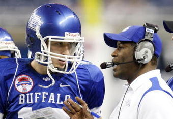 DETROIT - DECEMBER 05: Head coach Turner Gill of the Buffalo Bulls talks with Drew Willy #16 while playing the Ball State Cardinals in the MAC Championship game on December 5, 2008 at Ford Field in Detroit, Michigan. (Photo by Gregory Shamus/Getty Images)