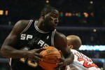 CHICAGO - OCTOBER 29:  DeJuan Blair #45 of the San Antonio Spurs moves the ball against Taj Gibson #22 of the Chicago Bulls during the game at United Center on October 29, 2009 in Chicago, Illinois. NOTE TO USER: User expressly acknowledges and agrees that, by downloading and/or using this Photograph, user is consenting to the terms and conditions of the Getty Images License Agreement. (Photo by Jonathan Daniel/Getty Images)