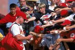 14 Mar 2000:  Mark McGwire #25 of the St. Louis Cardinals signs autographs after the Spring Training Game against the Cleveland Indians at the Roger Dean Stadium in Jupiter, Florida. The Indians defeated the Cardinals 11-4. Mandatory Credit: Harry How  /Allsport