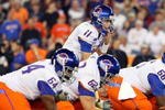 GLENDALE, AZ - JANUARY 04:  Quarterback Kellen Moore #11 of the Boise State Broncos under center against the TCU Horned Frogs during the Tostitos Fiesta Bowl at the Universtity of Phoenix Stadium on January 4, 2010 in Glendale, Arizona.  (Photo by Christian Petersen/Getty Images)