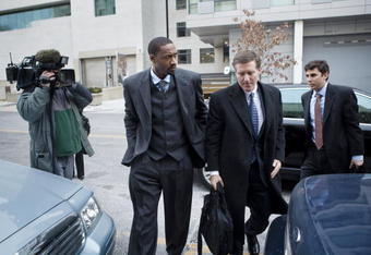 WASHINGTON -  JANUARY 15:  NBA player Gilbert Arenas (L) and his layer Kenneth L Wainstein (C) arrive at District of Columbia Court January 15, 2010 in Washington, DC.  The Washington Wizards star was to appear in court to answer to felony charges for bringing gun into the Wizards locker room.  (Photo by Brendan Smialowski/Getty Images)