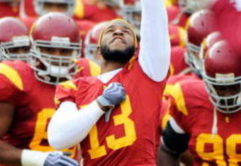 LOS ANGELES, CA - DECEMBER 05:  Tailback Stafon Johnson #13 of the USC Trojans leads his teammates to the field to take on Arizona Wildcats during the NCAA college football game at the Los Angeles Coliseum on December 5, 2009 in Los Angeles, California. Johnson suffered a season-ending weight lifting injury earlier this season.  (Photo by Kevork Djansezian/Getty Images)