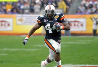 TAMPA, FL - JANUARY 1: Running back Ben Tate #44 of the Auburn Tigers rushes upfield against the Northwestern Wildcats in the Outback Bowl January 1, 2010 at Raymond James Stadium in Tampa, Florida.  (Photo by Al Messerschmidt/Getty Images)