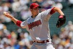DENVER - JULY 22:  Starting pitcher John Garland #52 of the Arizona Diamondbacks delivers against the Colorado Rockies during MLB action at Coors Field on July 22, 2009 in Denver, Colorado.  (Photo by Doug Pensinger/Getty Images)
