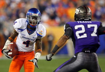 GLENDALE, AZ - JANUARY 04:  Titus Young #4 of the Boise State Broncos runs after a catch against Jason Teague #27 of the TCU Horned Frogs during the Tostitos Fiesta Bowl at the Universtity of Phoenix Stadium on January 4, 2010 in Glendale, Arizona.  (Photo by Christian Petersen/Getty Images)