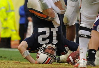 TAMPA, FL - JANUARY 1: Quarterback Chris Todd #12 of the Auburn Tigers tumbles for a sack against the Northwestern Wildcats in the Outback Bowl January 1, 2010 at Raymond James Stadium in Tampa, Florida.  (Photo by Al Messerschmidt/Getty Images) 