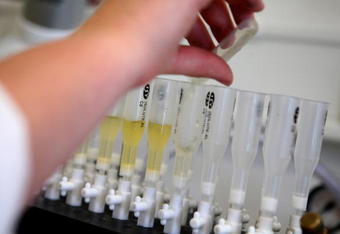 LONDON - JULY 10:  A detail view of a forensic scientist working with samples during a media open day at the UK Sport Drug Control Centre at King's College on July 10, 2008 in London, England.  (Photo by Paul Gilham/Getty Images)