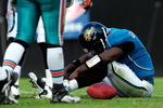 JACKSONVILLE, FL - DECEMBER 13:  David Garrard #9 of the Jacksonville Jaguars sits on the ground after being sacked during the game against the Houston Texans at Jacksonville Municipal Stadium on December 13, 2009 in Jacksonville, Florida.  (Photo by Sam Greenwood/Getty Images)