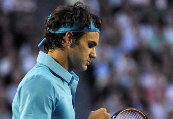 MELBOURNE, AUSTRALIA - JANUARY 29:  Roger Federer of Switzerland celebrates winning a point in his semifinal match against Jo-Wilfried Tsonga of France during day twelve of the 2010 Australian Open at Melbourne Park on January 29, 2010 in Melbourne, Australia.  (Photo by Joe Castro-Pool/Getty Images)