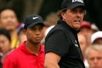 SHANGHAI, CHINA - NOVEMBER 08:  Phil Mickelson of the USA watches his tee-shot on the 13th hole as Tiger Woods of the USA looks on during the final round of the WGC-HSBC Champions at Sheshan International Golf Club on November 8, 2009 in Shanghai, China.  (Photo by Andrew Redington/Getty Images)