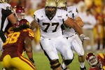LOS ANGELES - SEPTEMBER 1:  Idaho guard Mike Iupati #77 leads block against USC at the Los Angeles Memorial Coliseum on September 1, 2007 in Los Angeles, California. The Vandals were defeated by the top-ranked Trojans won 38-10. (Photo by Kevin Terrell/Getty Images)