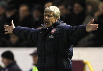 BURNLEY, ENGLAND - DECEMBER 16:  Arsene Wenger the manager of Arsenal looks frustrated during the Barclays Premier League match between Burnley and Arsenal at Turf Moor on December 16, 2009 in Burnley, England.  (Photo by Alex Livesey/Getty Images)