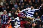 LONDON, ENGLAND - JANUARY 30:  Alejandro Faurlin of QPR jumps above Marcus Williams of Scunthorpe during the Coca-Cola Championship match between Queens Park Rangers and Scunthorpe United at Loftus Road on January 30, 2010 in London, England.  (Photo by Christopher Lee/Getty Images)