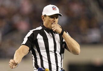 ARLINGTON, TX - JANUARY 9:  Referee Ed Hochuli is seen on the field during the 2010 NFC wild-card playoff game between the Dallas Cowboys and the Philadelphia Eagles at Cowboys Stadium on January 9, 2010 in Arlington, Texas. (Photo by Ronald Martinez/Getty Images)